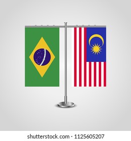 Table stand with flags of Brazil and Malaysia.Two flag. Flag pole. Symbolizing the cooperation between the two countries. Table flags
