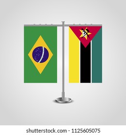 Table stand with flags of Brazil and Mozambique.Two flag. Flag pole. Symbolizing the cooperation between the two countries. Table flags