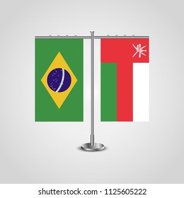 Table stand with flags of Brazil and Oman.Two flag. Flag pole. Symbolizing the cooperation between the two countries. Table flags
