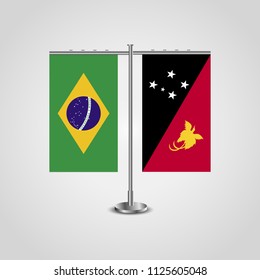 Table stand with flags of Brazil and Papua New Guinea.Two flag. Flag pole. Symbolizing the cooperation between the two countries. Table flags
