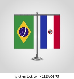 Table stand with flags of Brazil and Paraguay.Two flag. Flag pole. Symbolizing the cooperation between the two countries. Table flags
