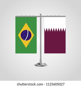 Table stand with flags of Brazil and Qatar.Two flag. Flag pole. Symbolizing the cooperation between the two countries. Table flags
