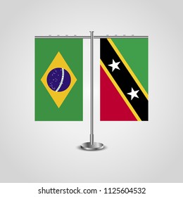 Table stand with flags of Brazil and Saint Kitts and Nevis.Two flag. Flag pole. Symbolizing the cooperation between the two countries. Table flags
