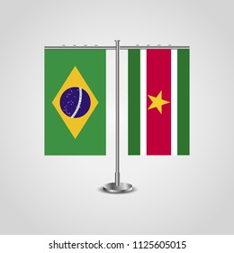 Table stand with flags of Brazil and Suriname.Two flag. Flag pole. Symbolizing the cooperation between the two countries. Table flags
