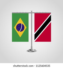 Table stand with flags of Brazil and Trinidad and Tobago.Two flag. Flag pole. Symbolizing the cooperation between the two countries. Table flags