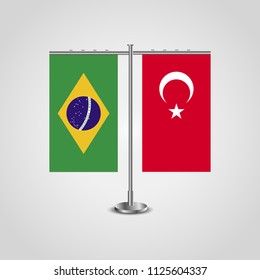 Table stand with flags of Brazil and Turkey.Two flag. Flag pole. Symbolizing the cooperation between the two countries. Table flags
