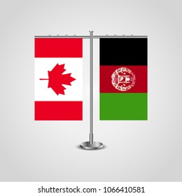 Table stand with flags of Canada and Afghanistan.Two flag. Flag pole. Symbolizing the cooperation between the two countries. Table flags