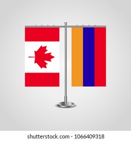 Table stand with flags of Canada and Armenia.Two flag. Flag pole. Symbolizing the cooperation between the two countries. Table flags