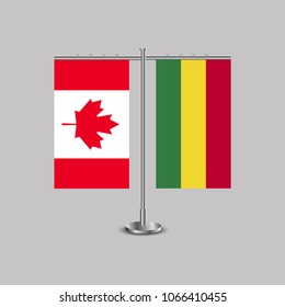 Table stand with flags of Canada and Bolivia.Two flag. Flag pole. Symbolizing the cooperation between the two countries. Table flags