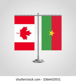 Table stand with flags of Canada and Burkina Faso.Two flag. Flag pole. Symbolizing the cooperation between the two countries. Table flags