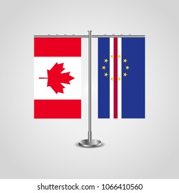 Table stand with flags of Canada and Cape Verde.Two flag. Flag pole. Symbolizing the cooperation between the two countries. Table flags