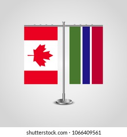 Table stand with flags of Canada and Gambia.Two flag. Flag pole. Symbolizing the cooperation between the two countries. Table flags