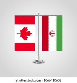 Table stand with flags of Canada and Iran.Two flag. Flag pole. Symbolizing the cooperation between the two countries. Table flags