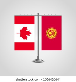 Table stand with flags of Canada and Kyrgyzstan.Two flag. Flag pole. Symbolizing the cooperation between the two countries. Table flags
