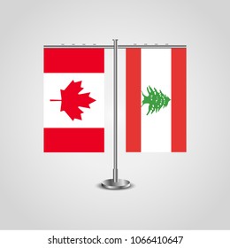 Table stand with flags of Canada and Lebanon.Two flag. Flag pole. Symbolizing the cooperation between the two countries. Table flags