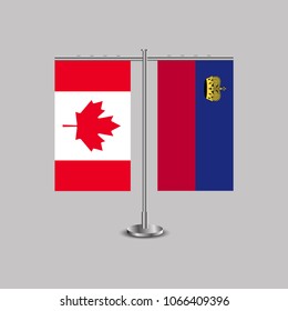 Table stand with flags of Canada and Liechtenstein.Two flag. Flag pole. Symbolizing the cooperation between the two countries. Table flags