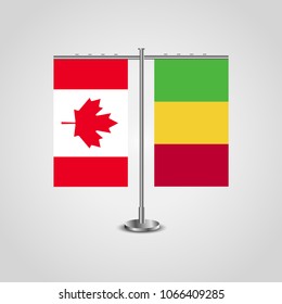 Table stand with flags of Canada and Mali.Two flag. Flag pole. Symbolizing the cooperation between the two countries. Table flags