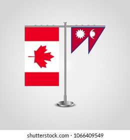 Table stand with flags of Canada and Nepal.Two flag. Flag pole. Symbolizing the cooperation between the two countries. Table flags