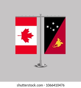 Table stand with flags of Canada and Papua New Guinea.Two flag. Flag pole. Symbolizing the cooperation between the two countries. Table flags