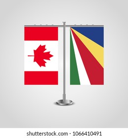 Table stand with flags of Canada and Seychelles.Two flag. Flag pole. Symbolizing the cooperation between the two countries. Table flags