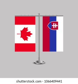 Table stand with flags of Canada and Slovakia.Two flag. Flag pole. Symbolizing the cooperation between the two countries. Table flags