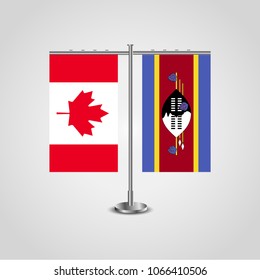 Table stand with flags of Canada and Swaziland.Two flag. Flag pole. Symbolizing the cooperation between the two countries. Table flags