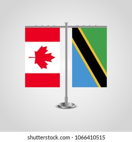 Table stand with flags of Canada and Tanzania.Two flag. Flag pole. Symbolizing the cooperation between the two countries. Table flags