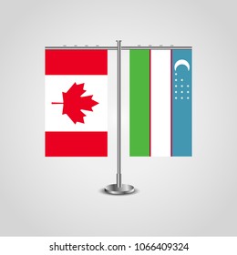 Table stand with flags of Canada and Uzbekistan.Two flag. Flag pole. Symbolizing the cooperation between the two countries. Table flags