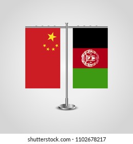 Table stand with flags of China and Afghanistan.Two flag. Flag pole. Symbolizing the cooperation between the two countries. Table flags