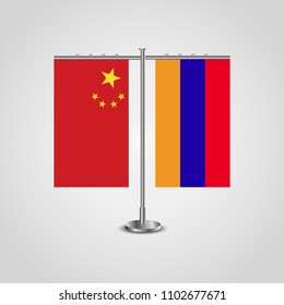 Table stand with flags of China and Armenia.Two flag. Flag pole. Symbolizing the cooperation between the two countries. Table flags