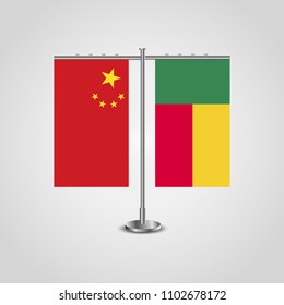 Table stand with flags of China and Benin.Two flag. Flag pole. Symbolizing the cooperation between the two countries. Table flags