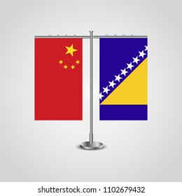 Table stand with flags of China and Bosnia and Herzegovina.Two flag. Flag pole. Symbolizing the cooperation between the two countries. Table flags