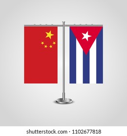 Table stand with flags of China and Cuba.Two flag. Flag pole. Symbolizing the cooperation between the two countries. Table flags
