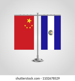 Table stand with flags of China and El Salvador.Two flag. Flag pole. Symbolizing the cooperation between the two countries. Table flags