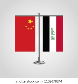 Table stand with flags of China and Iraq.Two flag. Flag pole. Symbolizing the cooperation between the two countries. Table flags