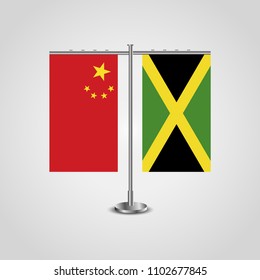 Table stand with flags of China and Jamaica.Two flag. Flag pole. Symbolizing the cooperation between the two countries. Table flags