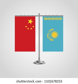 Table stand with flags of China and Kazakhstan.Two flag. Flag pole. Symbolizing the cooperation between the two countries. Table flags