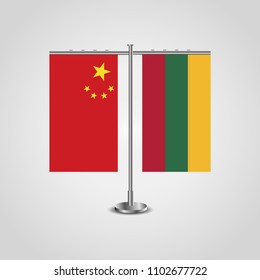 Table stand with flags of China and Lithuania.Two flags. Flag pole. Symbolizing the cooperation between the two countries. Table flags