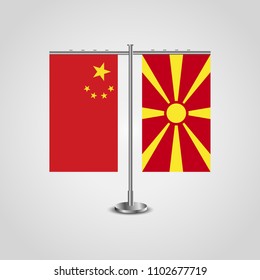Table stand with flags of China and Macedonia.Two flag. Flag pole. Symbolizing the cooperation between the two countries. Table flags