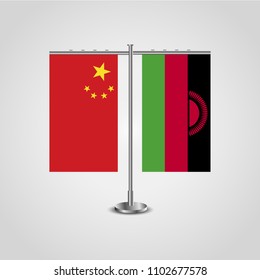 Table stand with flags of China and Malawi.Two flag. Flag pole. Symbolizing the cooperation between the two countries. Table flags