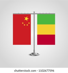 Table stand with flags of China and Mali.Two flag. Flag pole. Symbolizing the cooperation between the two countries. Table flags
