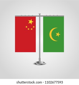 Table stand with flags of China and Mauritania.Two flag. Flag pole. Symbolizing the cooperation between the two countries. Table flags