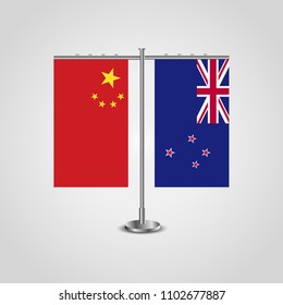 Table stand with flags of China and New Zealand.Two flag. Flag pole. Symbolizing the cooperation between the two countries. Table flags