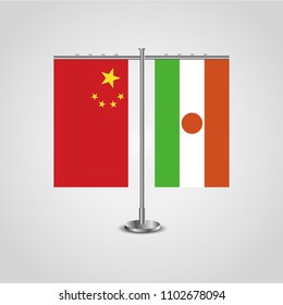 Table stand with flags of China and Niger.Two flag. Flag pole. Symbolizing the cooperation between the two countries. Table flags