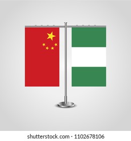 Table stand with flags of China and Nigeria.Two flag. Flag pole. Symbolizing the cooperation between the two countries. Table flags