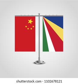 Table stand with flags of China and Seychelles.Two flag. Flag pole. Symbolizing the cooperation between the two countries. Table flags