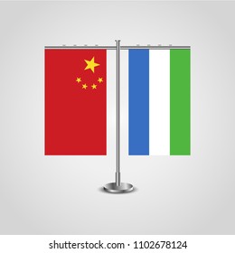 Table stand with flags of China and Sierra Leone.Two flag. Flag pole. Symbolizing the cooperation between the two countries. Table flags