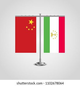 Table stand with flags of China and Tajikistan.Two flag. Flag pole. Symbolizing the cooperation between the two countries. Table flags