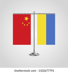 Table stand with flags of China and Ukraine.Two flag. Flag pole. Symbolizing the cooperation between the two countries. Table flags