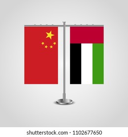 Table stand with flags of China and United Arab Emirates.Two flags. Flag pole. Symbolizing the cooperation between the two countries. Table flags
